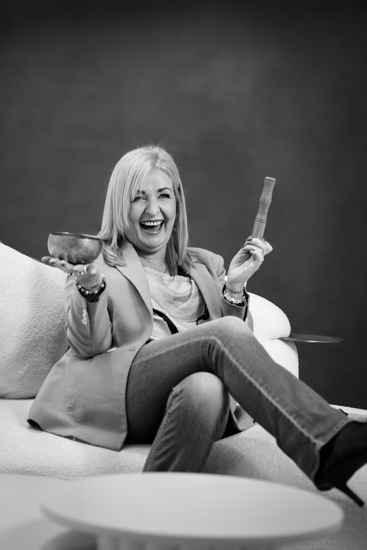 Alvagh holding a singing bowl during a SoulStyle session